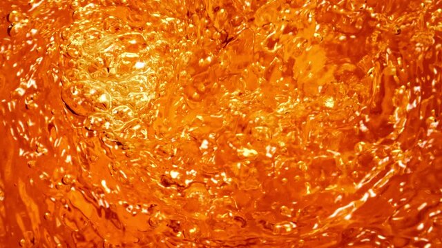 Super Slow Motion Shot of Golden Liquid Vortex at 1000 fps.
