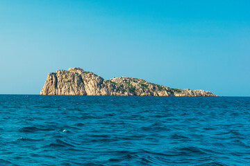 Fototapeta na wymiar Island over the blue sea in Sardinia