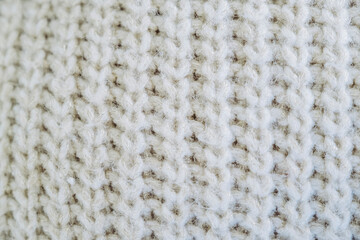 Gros plan sur des mailles tricotées en laine beige - Arrière plan texture laineuse douce