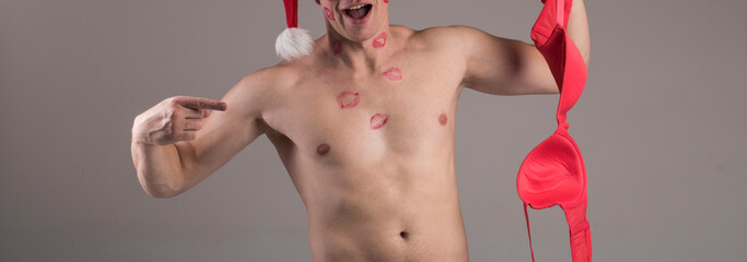 Boy is holding a pink bra. Sexy photo. Bra. Erotica. Sensual. 