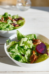 Vegan salad with lettuce, red beet and pecan nuts. Healthy Food. Diet. Healthy lifestyle concept. Cooking At Home