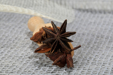 Portion of star anise in a wooden scoop