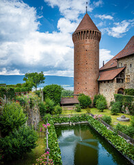 Сourtyard of the Castle of Chenaux in the city of Estavayer-le-Lac with the lake Neuchatel on the background