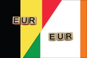 Belgium and Ireland currencies codes on national flags background