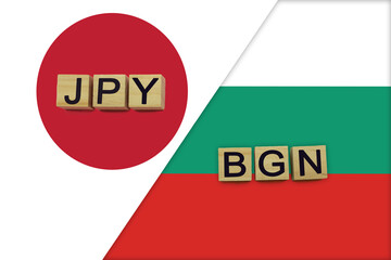 Japan and Bulgaria currencies codes on national flags background