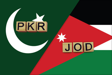 Pakistan and Jordan currencies codes on national flags background