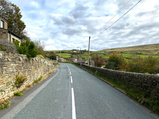 Looking along, Denholme Road, in the village of, Leeming, Keighley, UK