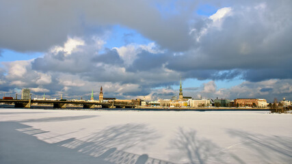 Fototapeta na wymiar riga, city panorama, frozen river and snow in the foreground