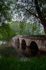 Roman bridge reflection on river Bosna in Sarajevo © Minchy
