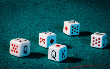 poker dice on a green mat,poker concept.