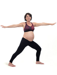 Fototapeta na wymiar view of a pregnant woman doing standing exercises on white background, warrior pose
