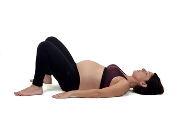 Fototapeta na wymiar pregnant woman doing floor exercises on white backgroun,