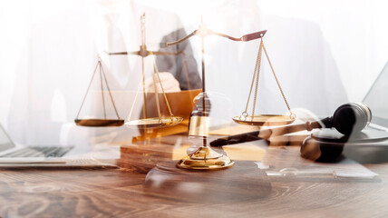 Justice and law concept.Male judge in a courtroom with the gavel, working with, computer and...