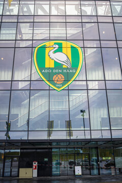 The Hague, Netherlands - January 2021: Entrance of Soccer stadium of soccer club "ADO Den Haag". Colors of the football club are green and yellow and the symbol is the Hague stork.