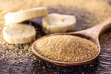 wooden spoon with alternative flour, vegan food, typical of Brazil, made with cassava. Typical South American root