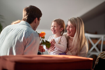 A young happy family enjoying Valentine's day at home together. Family, home, together