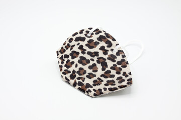 Ffp2 patterned mask on white background. Coronavirus protection.