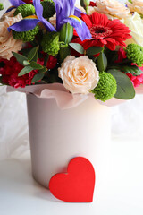 Happy Valentine's Day greeting card. beautiful bouquet of flowers and red heart 