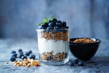 Blueberry Greek yogurt granola parfait in a glass
