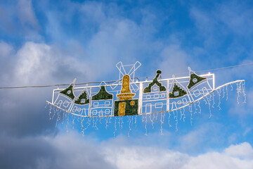 Beautiful christmas decoration in a dutch city against a cloudy sky