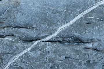Background image of a metamorphic surface with a white stripe.