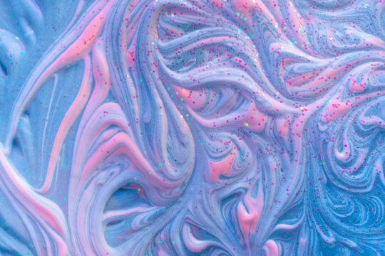 Liquid marble fluid art background. Volume relief texture with blue and hot pink