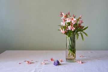 bouquet of flowers in glass with water, still life