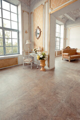 very rich interior of the apartment with golden decorations on the walls in the Baroque style and luxury furniture with gold paint.