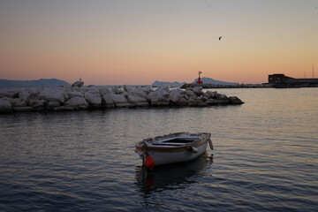 Fototapeta premium ship in the sunset with the vesuvius