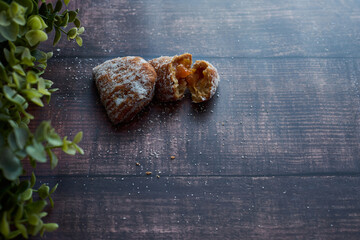 sweet potato christmas candy on wooden table with green plants