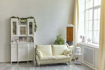 Cozy vintage living room interior with wooden sideboard