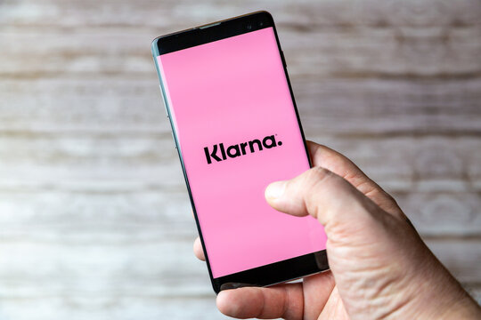 02-05-2021 Portsmouth, Hampshire, UK A Mobile phone or cell phone being held showing the Klarna app open on screen
