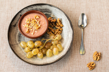 pelamushi, a georgian traditional dessert made from grape juice side view, decorated with walnuts