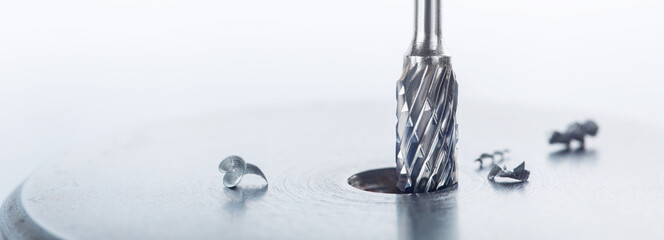 end mill bit cutting big hole in a steel billet