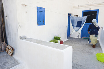 old patched clothes of an old lady in a courtyard of a house in Olympos