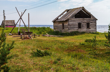 Fototapeta na wymiar An old abandoned village on the Tersk coast of the White Sea, Kola Peninsula, Russia, summer.