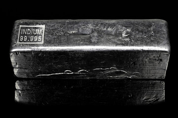 99.995% fine indium ingot isolated on black background