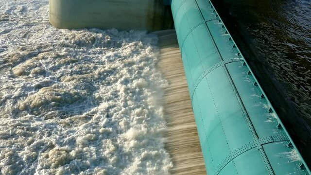 roaring water at sluice baldeney-sea in Essen NRW Germany, 29.01.2021, flood flowing river