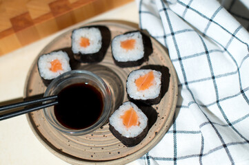 Sushi set and chopsticks on napkin