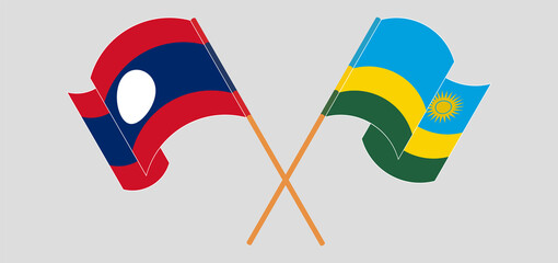 Crossed and waving flags of Laos and Rwanda