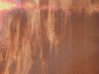 Fragment of an old, rusty metal wall.