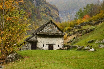 Fototapeta na wymiar Old stone house in the mountains of Switzerland Tessin