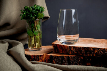 Mojito cocktail on a dark background. Wooden stand.