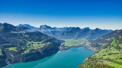 fantastic view from amden over lake walen with a view of the small village of weesen and the mountains of glarus