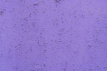 the wooden background is painted purple, the aged paint is peeling off