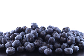 fresh blueberries on a white background, sweet berries