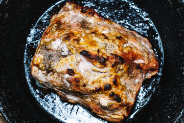 Meat is fried in a pan close-up