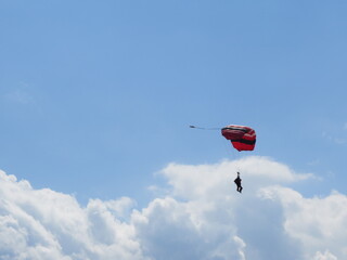 Parachutists are flying, tandem jump, the parachute looks very beautiful in the sky