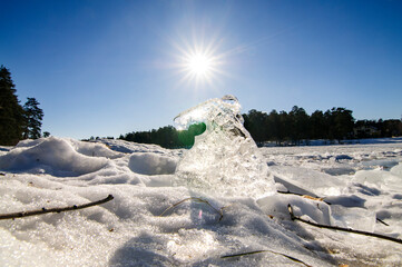 The melting ice floe in Russian winter landscape.