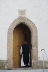 Catholic Priest on his way to church